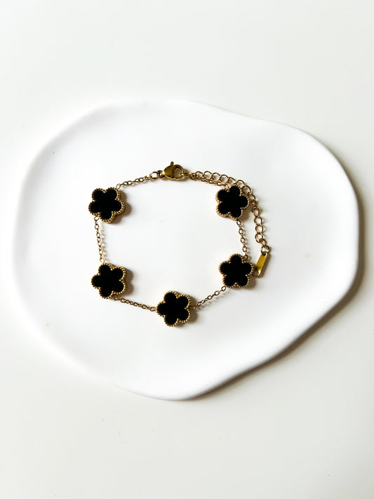 Bracelet doré trèfles noirs - Elégance porte-bonheur