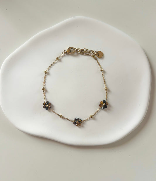 Bracelet doré avec 3 fleurs marrons